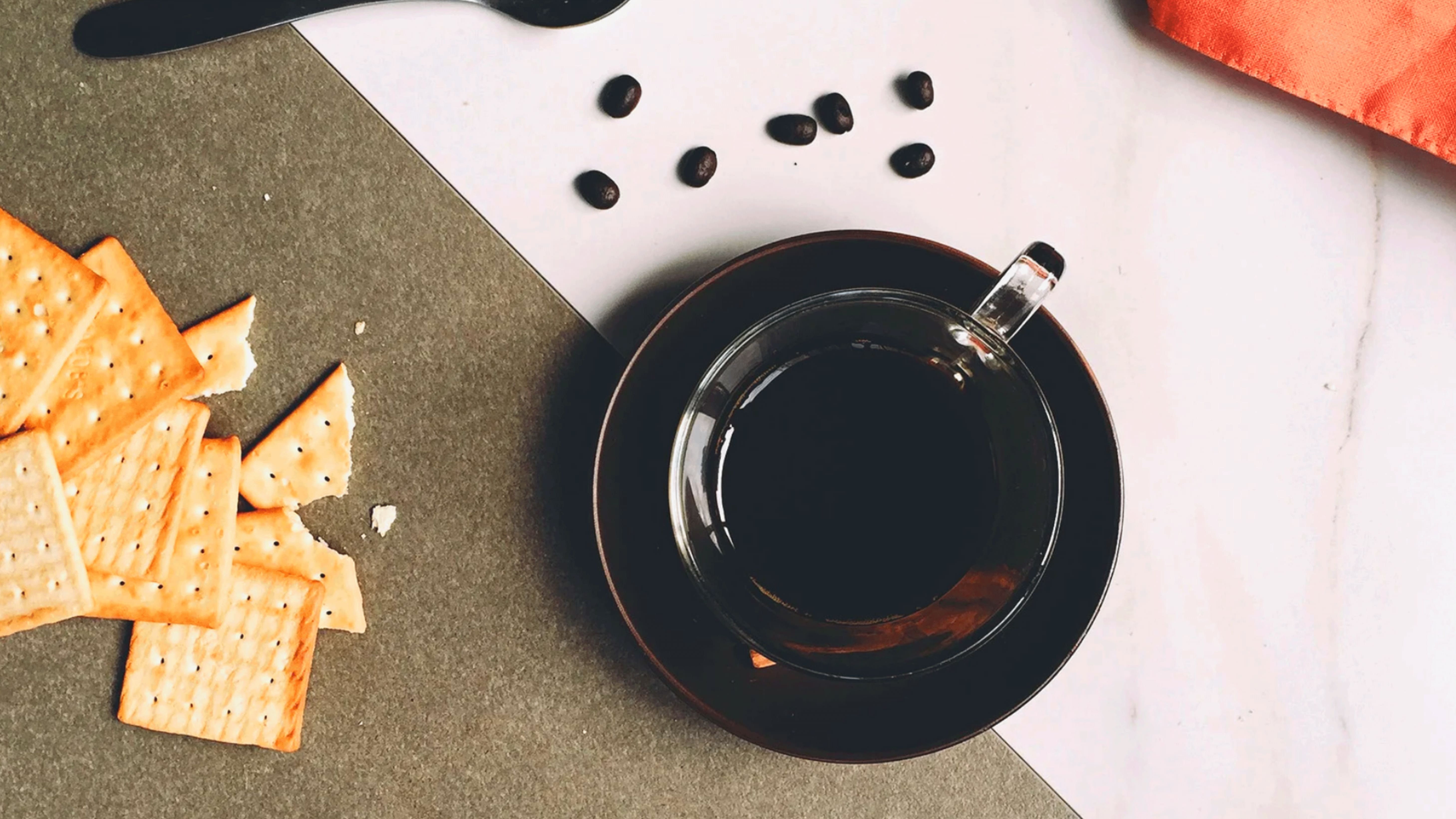 A cup of coffee and cookies